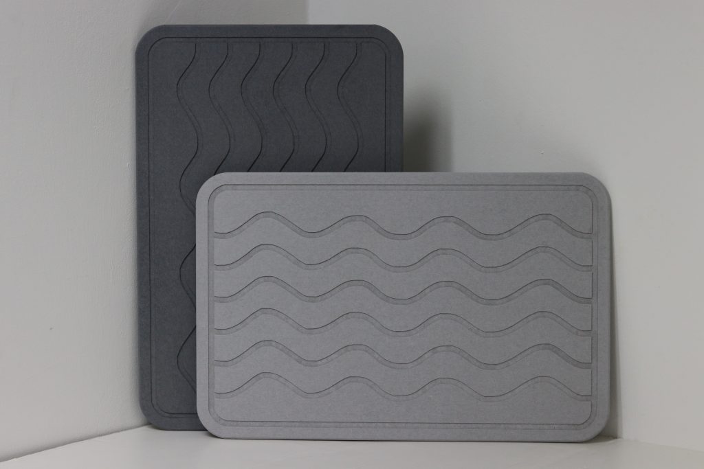 GLAW™ Ishi Mats that are dark and light grey in color on display